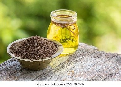 Perilla Seeds And Oil On Nature Background.