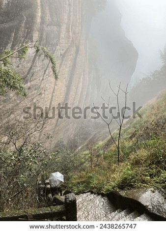 Perilous Path Beneath the Steep Cliffs in Wuyi, Fujian, China.