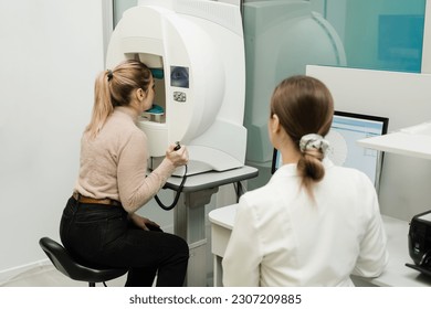 Perimetry eyes test for early sign of glaucoma of woman patient of ophthalmology clinic. Perimetry visual field test for measure all areas of eyesight, including side, or peripheral vision