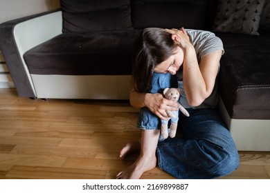 Perinatal loss reproductive chalenge concept - female holding a teddy bear toy - Shutterstock ID 2169899887
