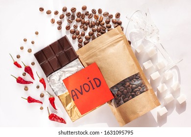 Period Diet Concept. Foods To Avoid During Menstruation Bleeding Flat Lay. Products Worsen Symptoms Of Feminine Critical Days Stomach Pain. Coffee, Caffeine Drinks, Dark Chocolate, Spices, Sugar, Salt