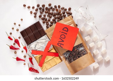 Period Diet Concept. Foods To Avoid During Menstruation Bleeding Flat Lay. Products Worsen Symptoms Of Feminine Critical Days Stomach Pain. Coffee, Caffeine Drinks, Dark Chocolate, Spices, Sugar, Salt