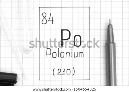 The Periodic table of elements. Handwriting chemical element Polonium Po with black pen, test tube and pipette. Close-up.