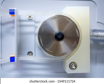 Peristaltic pump with plastic tubes. With rollers moving.