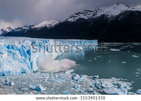 Сollapse of Perito Moreno Glacier in the lake with icebergs. South America. Argentina. Patagonia.