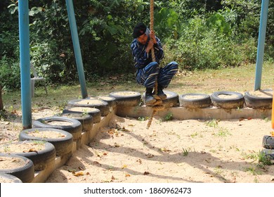 Perlis,Malaysia-12 February 2018: Malaysia's National Service Program PLKN Trainee Doing Activity Called Tarzan Swing