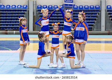 Perm, Russia - March 28, 2015. Championship Perm Krai On Cheerleading. Start Of Performances In Category Of Group Stunt Girls In Blue White Suits