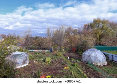 Permalinker.Ousenny garden with a round greenhouse