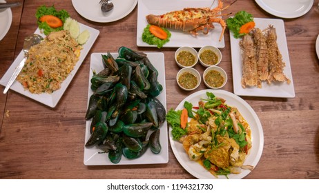 Perna viridis, Crab meat fried ric, Baked prawn with cheese, Fried crayfish, Fried crab with curry powder with sauce. - Shutterstock ID 1194321730