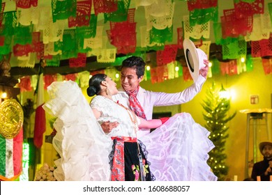 PEROTE, VERACRUZ- SEPTEMBER 15, 2019: Portrait Of A Young Couple Dressed With Traditional Clothes From Veracruz, Dancing At Mexican Independence Day Party At Perote, Veracruz, Mexico