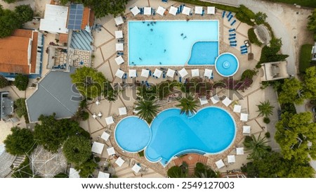 Similar – Image, Stock Photo zenithal aerial view of a beach in summer with bathers, water skates and thatched beach umbrellas for rent, handicapped access ramp and lookout tower seen from above, drone view