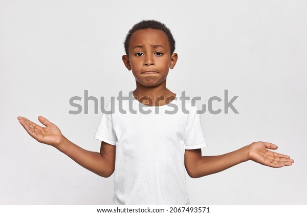 Perplexed 9yearold Kid Tighten Lips Shrugging Stock Photo 2067493571 ...