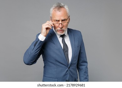 Perplexed Elderly Gray-haired Mustache Bearded Business Man In Classic Blue Suit Shirt Tie Isolated On Grey Wall Background Studio Portrait. Achievement Career Wealth Business Concept. Looking Camera