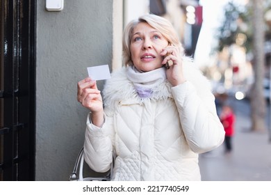 Perplexed Woman Is Asking About Address By Phone For Meet Outdoor.