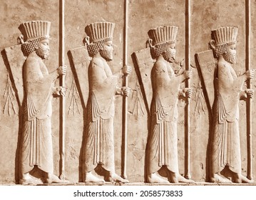 PERSEPOLIS, IRAN - 9.10.2021: Bas-relief of Cyrus the Great's soldiers the achaemenid empire in central part of perspolise, Shiraz, Iran. UNESCO World Heritage