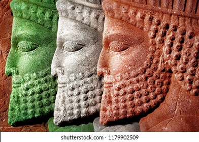 Persepolis. Iran. Ancient Persia. Bas-relief Carved On The Walls Of Old Buildings. Colors Of National Flag Of Iran.