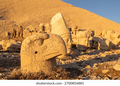 Persian eagle and apollo statues of Mount Nemrut at sunset.
