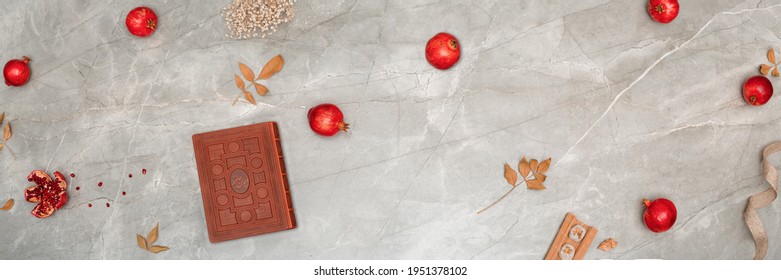 Persian Yalda Design With Hafez, Red Pomegranate And Ribbons On Marble Background.