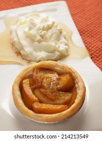 Persimmon Pie On Plate With Whipping Cream And Honey