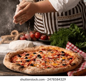 A person adds seasoning to a just-baked pizza - Powered by Shutterstock