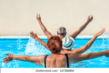 person aged group doing water aerobics in a swimming pool during a spa treatment - Powered by Shutterstock