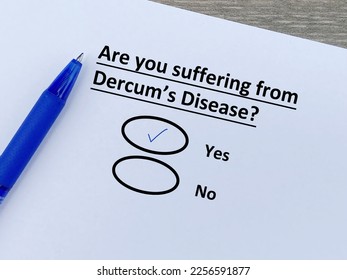 A person is answering question about illness. She is suffering from Dercum's disease. - Shutterstock ID 2256591877