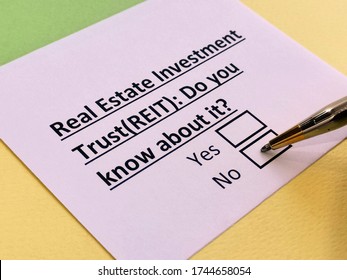 A person is answering question about real estate investment trust (REIT). - Shutterstock ID 1744658054
