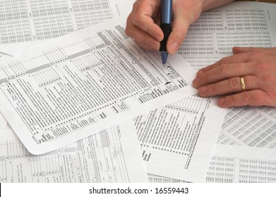 A Person Attempting To Do His Taxes.