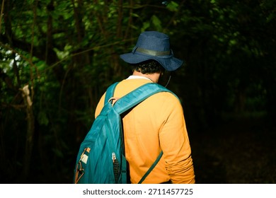 Person with backpack exploring nature, finding quiet, and disconnecting from everyday stress