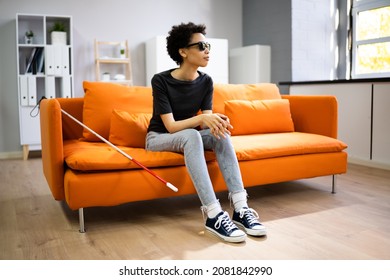 Person With Blindness Disability Sitting In Living Room - Powered by Shutterstock