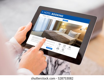 Person booking hotel room on tablet