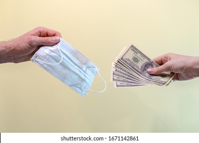 A person buys a medical mask. The high price of masks and the growing demand during quarantine. Concept. - Shutterstock ID 1671142861