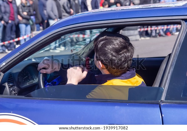 person in car,\
sports car driver in the\
car
