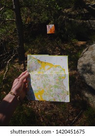 Person Check The Map Within Orienteering Run.  Sportsman Running In Difficult Rocky Terrain.