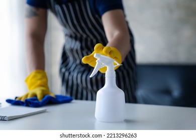 Person Cleaning The Room, The Cleaner Is Wiping The Desk In The Company Office. Cleaning Staff. Concept Of Cleanliness In The Organization.