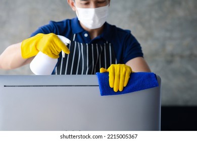 Person Cleaning Room, Cleaning Worker Is Using Cloth To Wipe Computer Screen In Company Office Room. Cleaning Staff. Concept Of Cleanliness In The Organization.