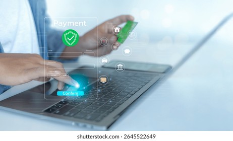 A person confirming an online payment using a credit card on a laptop. Concept of secure digital transaction, fintech, and fast financial technology for e-commerce.