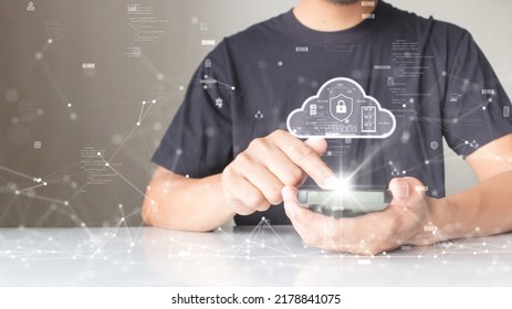 A Person Is Connecting To The Internet Through A Smartphone To Download And Upload Data To Cloud Computing Technology With Cybersecurity Protection. With A Small Binary Polygon Icon On The Background.