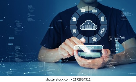 A person is connecting to the Internet through a smartphone to access cloud computing technology that has cybersecurity protection to protect user data. small binary code polygon on blue background.