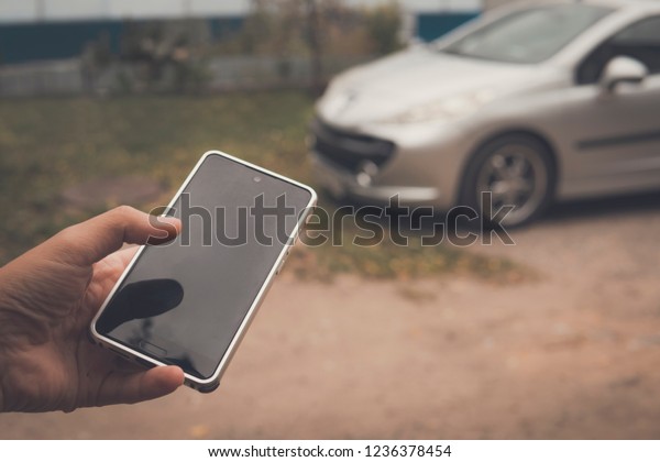 Person connects with smart car by phone
application. Mobile app controls the work of a vehicle computer.
Keyless car unlock by using cellphone. Vehicle remote start via
app. Car theft by
cellphone