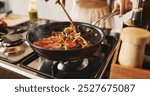 Person, cooking and pan with stir fry on stove for food, meal prep or vegetables in kitchen at home. Closeup, spoon and wok with peppers and organic ingredients for taste, diet or lunch at house