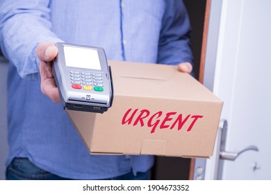 person delivers package home with dataphone to make payment. Friendly worker, high quality delivery service - Powered by Shutterstock