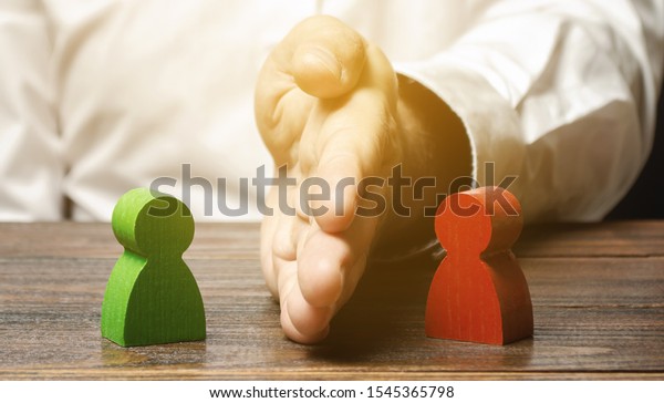 The person divides with the palm the red and\
green figures of people. Orbiter, the solution of controversial\
issues and conflicts of interest. Stop the conflict, the mediator.\
Dispute resolution.