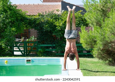 Person doing a handstand by the pool 3