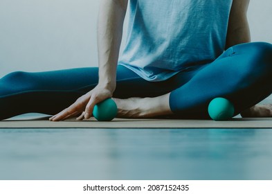 Person Doing Yin Yoga And Myofascial Release On Base Of Palm And Shin Muscle. Concept: Self-care Practices At Home, SMFR, Myoyin