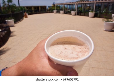 Person Drinking A Cup Of Coffee In First-person Perspective