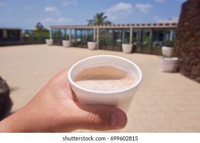 Person Drinking A Cup Of Coffee In First-person Perspective