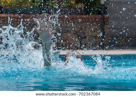 Person drowns in the pool with splashes