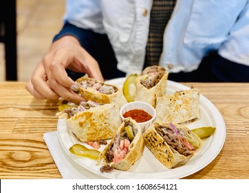 Person Eating Gyro Pita Sandwich Steak Lamb Meat With French Fries Shawerma Platter