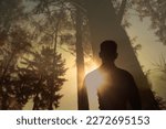 Person enjoying peace and quiet early morning in nature forest 